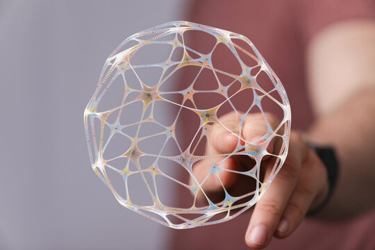 An abstract, futuristic digital network globe, its lines and connections highlighted as a finger touches it. Represents data, connect