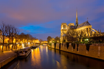 Panoramic view of Notre Dame Cathedral in Paris at night, France