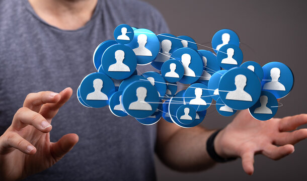 Abstract concept of social network connections or business teamwork. Hands holding network icons representing communication and community.