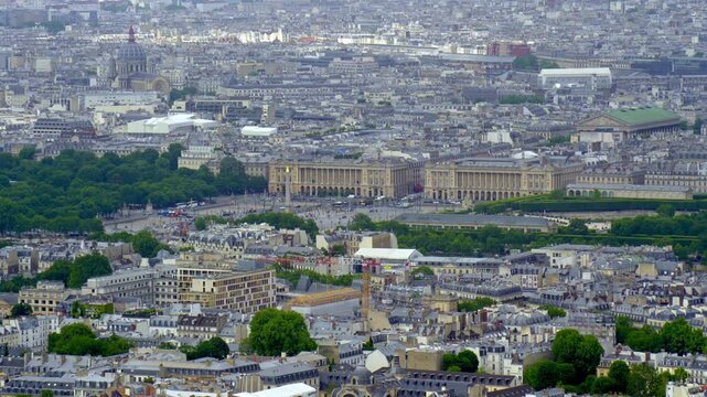 High angle view of Paris with its iconic monuments and buildings, including the Place de la Concorde and the Hotel de la Marine, showcasing the city's vast and historic urban landscape