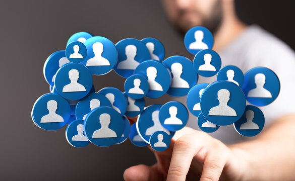 Hand touching network of user icons floating in air, representing connection and global community for online platform.