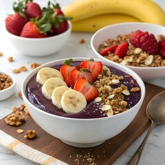 Vibrant acai bowl with granola, banana, and berries, healthy breakfast or snack
