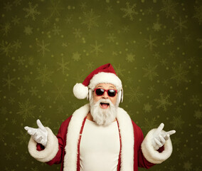 Excited Santa Claus with Sunglasses and Headphones on Green Snowflake Background