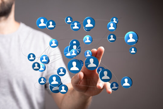 Connecting people through a digital network, hand interacting with user icons, technology and the concept of online connections.
