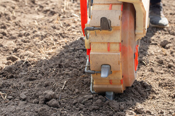 Hand-push corn seeder. Simple machinery for farmers.