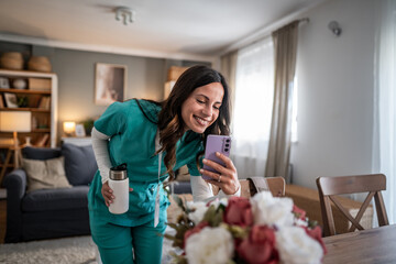 Nurse communicating with family during video call at home