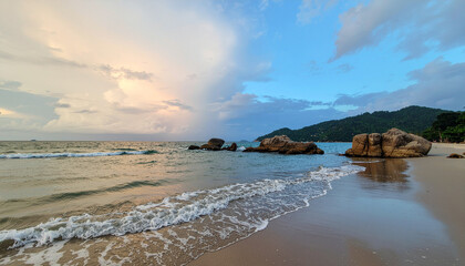 Serene beach landscape with multi cloud sky and rocks creates peaceful hazard scenario at shoreline during sunset