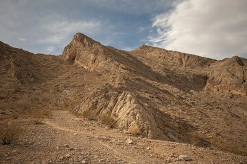Rugged Desert Ridge under Shifting Clouds