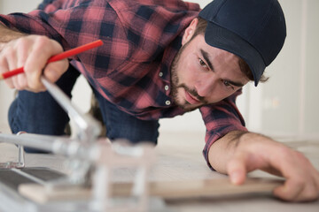 male carpenter doing kitchen furniture installation