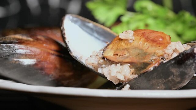 Close-up of Stuffed Mussels on a Plate. Rice Outside the Shell