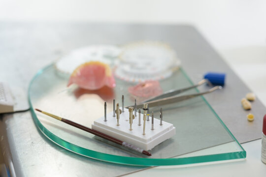 model of dental prothesis and dental tools