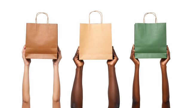 Diverse hands holding different eco-friendly paper shopping bags isolated on white background