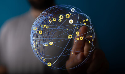 Abstract image of a person's hand interacting with a glowing digital globe representing global connectivity, technology, and networki