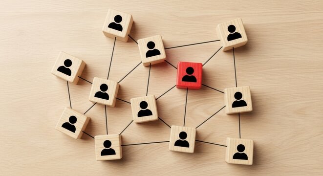 Network of wooden blocks with person icons on light wood surface