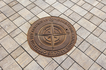 manhole cover on the tiled pavement