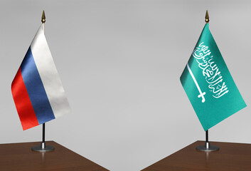 Table flags Russia and Saudi Arabia on grey blurred background