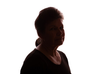 Dark silhouette of an elderly woman, pensioner, curly hair - isolate