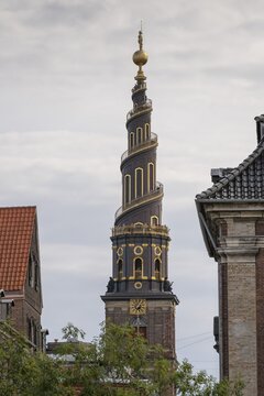 Corkscrew-shaped tower of the Evangelical Lutheran Church of the Saviour, in front of Frelsers Kirke, Christianshavn, Copenhagen, Denmark