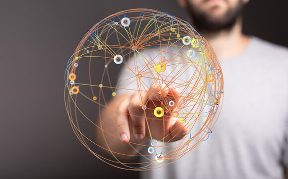 Close-up of a hand pointing at a glowing 3D globe representing global connections, technology, innovation, and digital transformation