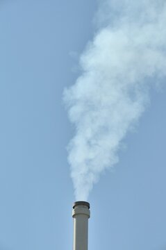 Smoking chimney of a lignite-fuelled combined heat and power plant, Germany