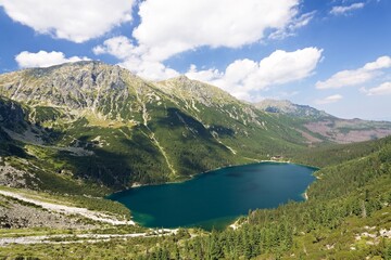 View of the mountain lake Morskie Oko and Opalony Wierch in the Rybiego Potoka Valley, Polskie Tatry. Poland. Europe.