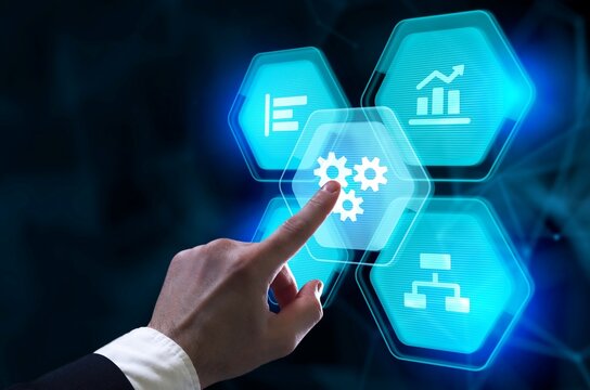 Finger touching hexagonal icon with gears on digital interface technology innovation