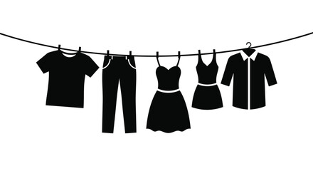 A collection of black clothing items hangs on a clothesline secured by clothespins.