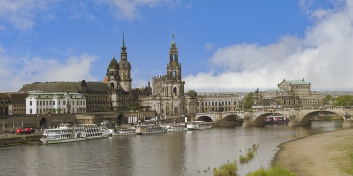 Historic center viewed from the Elbe with the Cathedral of the Holy Trinity, the Semperoper and the Carola bridge, Dresden, Saxony, Germany