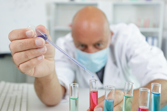 senior male researcher carrying out scientific research