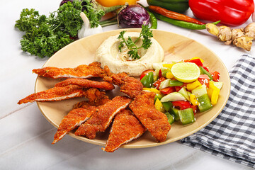 Slices pork schnitzel with vegetables