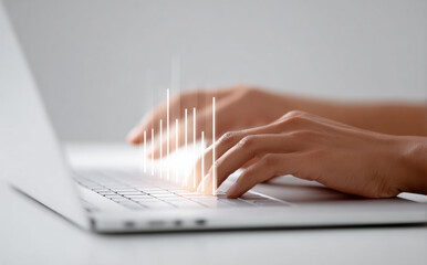 Hand typing on laptop keyboard with glowing data graph. focused concept for business, technology, financial analysis, investment strategy and successful growth
