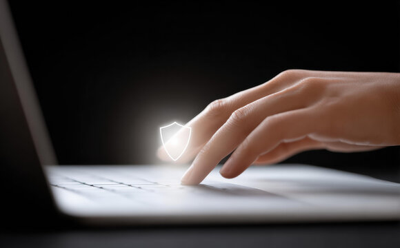 Close up of human hand with finger typing on laptop keyboard. person working with digital computer technology on internet showing intense concentration and focus