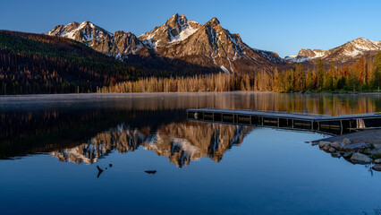 Stanley lake reflection with boat dock
