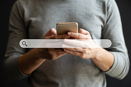 Person using smartphone with search bar for online search internet browsing and information retrieval