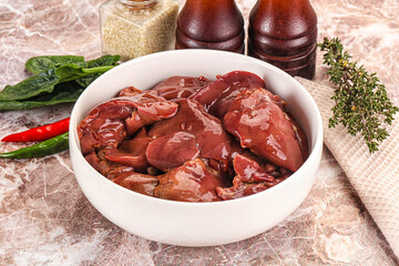 Raw uncokked chicken liver in the bowl