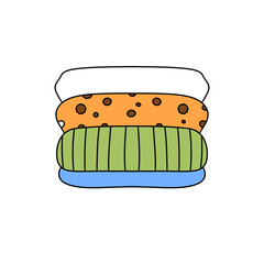 A stack of clothes with a cookie on top