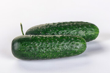 Ripe green raw two cucumbers