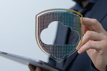 Abstract cloud data security concept with a hand holding a shield representing cloud protection....