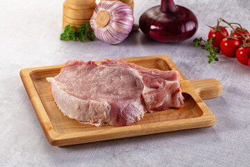 Raw pork steak with bone