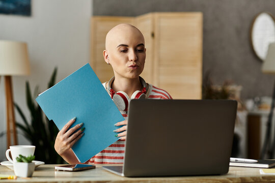 Bald woman with alopecia enjoys a cozy day at home while working on her laptop - Powered by Adobe