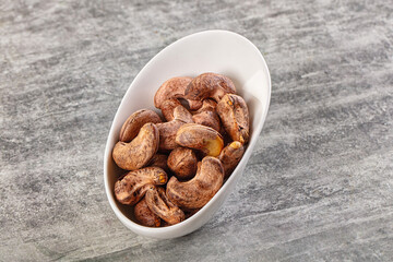 Unpeeled cashew nuts in the bowl