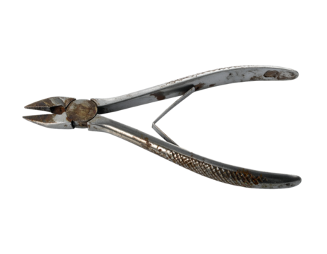 Old rusty diagonal cutting pliers with spring and textured handles, metal hand tool for wire work on isolated background