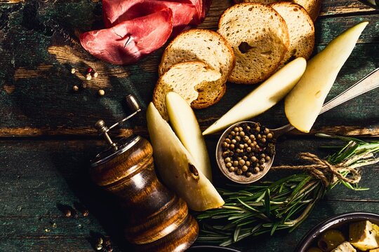 Rustic charcuterie board with cheese bread and spices - Powered by Adobe