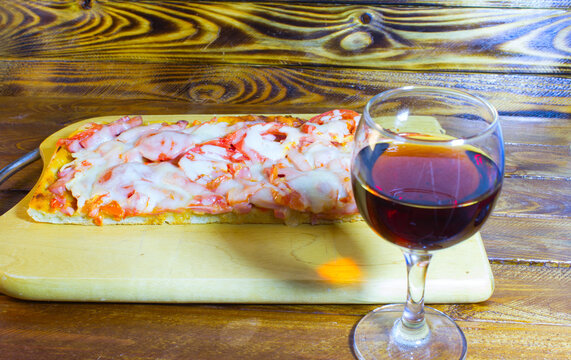 Glass of red wine and pizza. - Powered by Adobe
