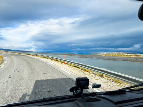 Autumnal coastal highway drive captured from dashboard perspective