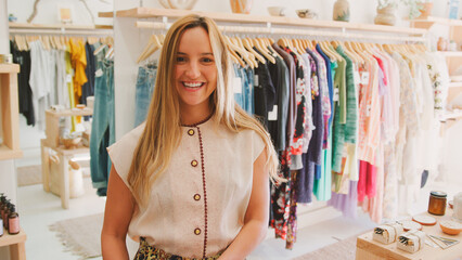 Portrait Of Female Sales Assistant In Clothing And Gift Store