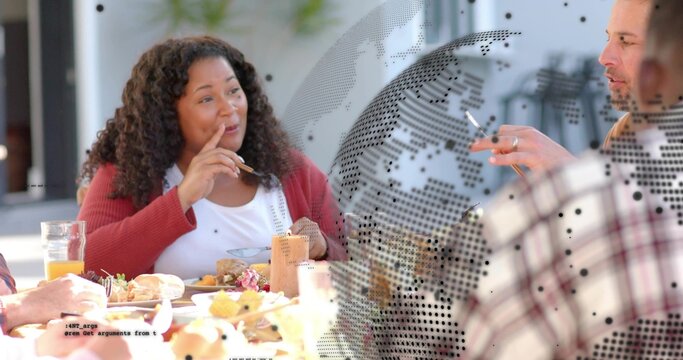 Speaking woman in red cardigan holding fork near mouth at cafe, with pastries and dotted partition