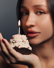 Beauty portrait of a pretty girl with a cake 