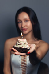 Beauty portrait of a pretty girl with a cake 