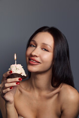Beauty portrait of a pretty girl with a cake 